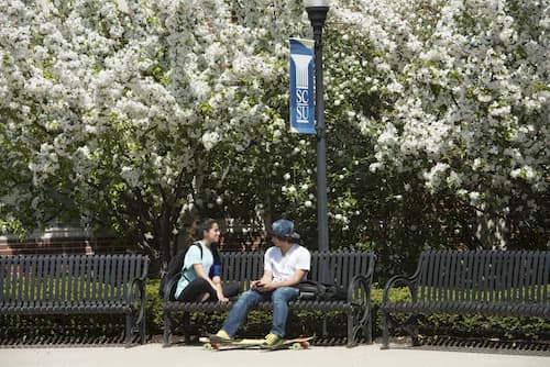 Students socializing in front of Morrill